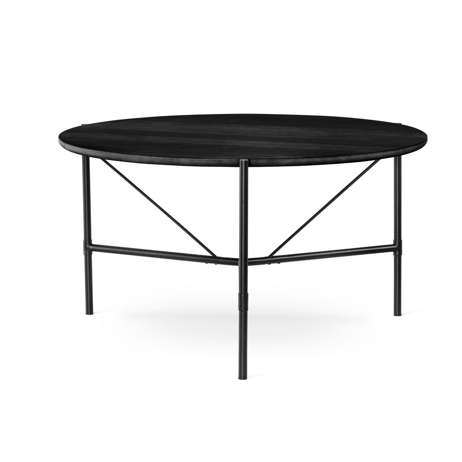 Cane matbord runt 135 cm svartbetsad ek, svart metallunderrede